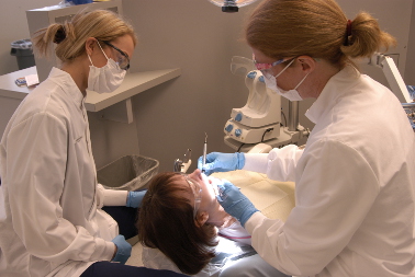 Photo of dental assistants with patient