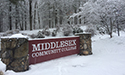 college sign covered in snow saying Middlesex Community College