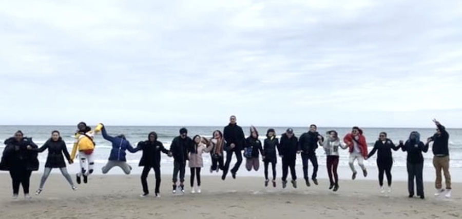 mcc students pose-jumping at ogunquit beach