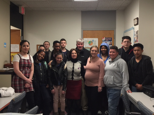 Maria Cunha with students and student employees  of the OSY program in her officeprogram